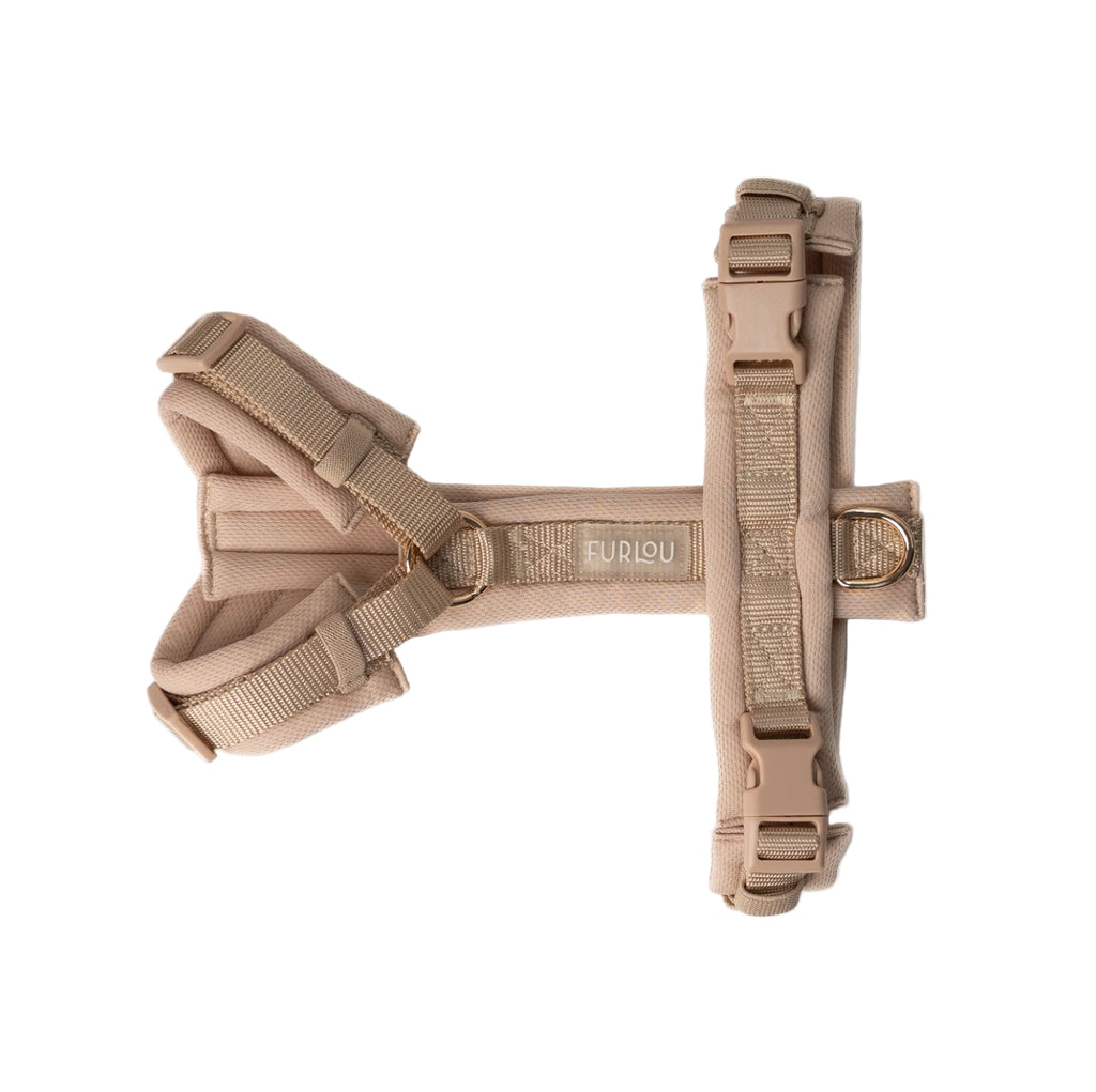 Beige dog harness on a white background