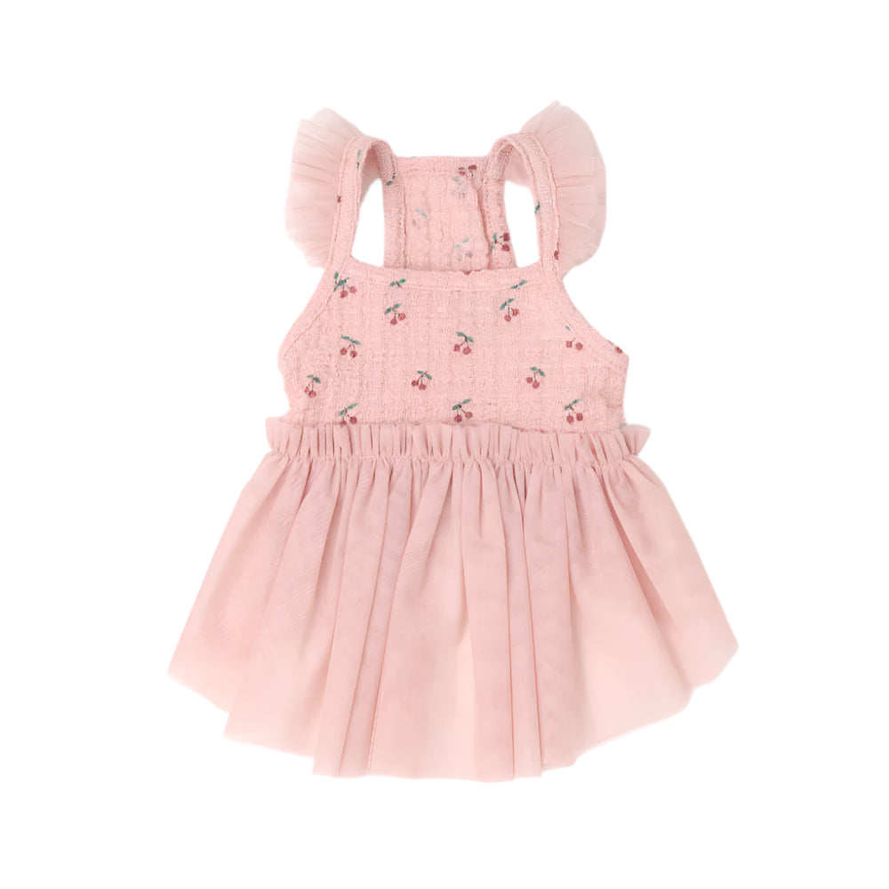 Pink dress with cherry embroidery on a white background