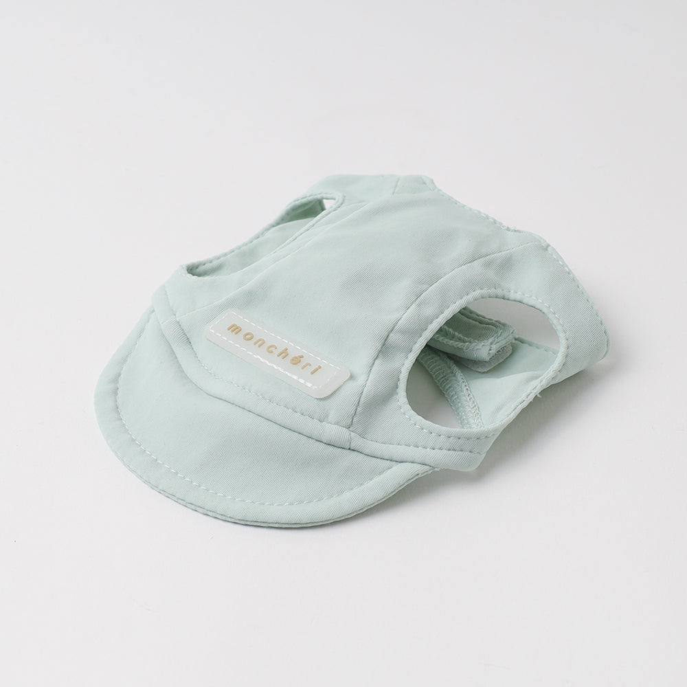 Light blue pet muzzle with 'monchhichi' branding on a white background
