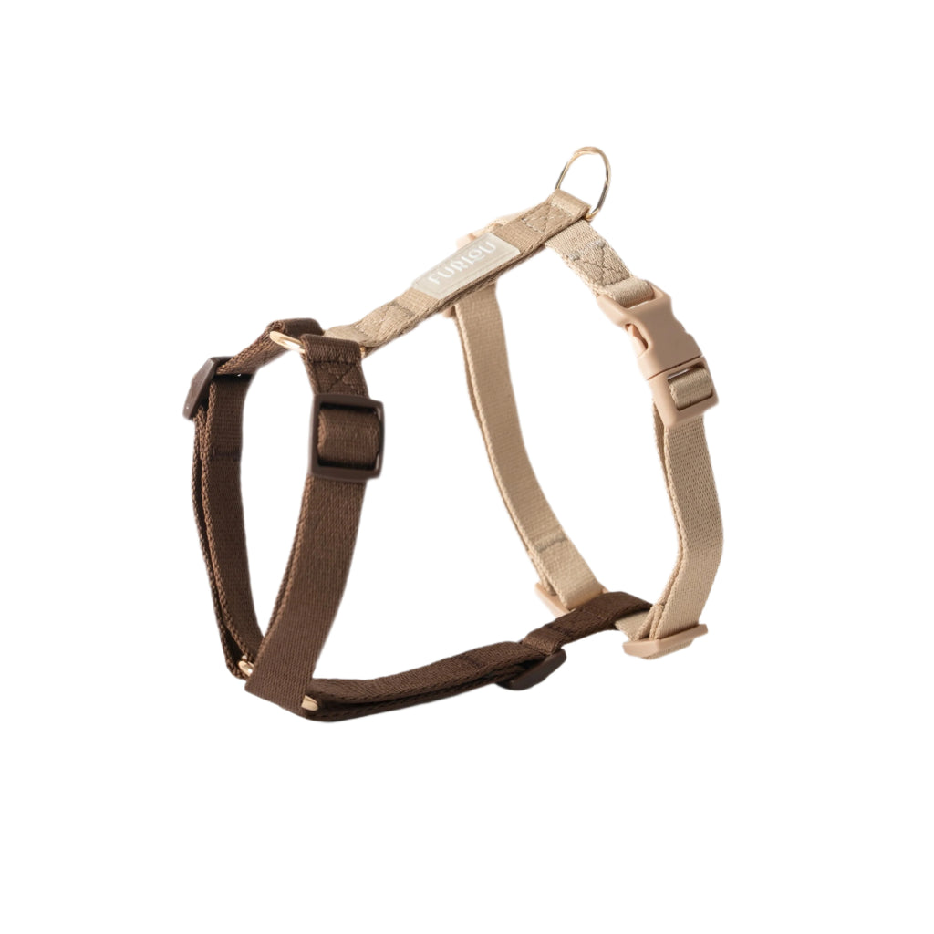 Brown and beige dog harness on a white background