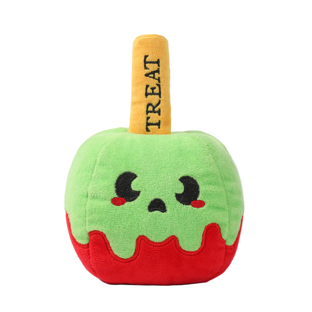 Plush toy shaped like a green apple with a red bottom and a yellow handle labeled 'TREAT' on a white background.