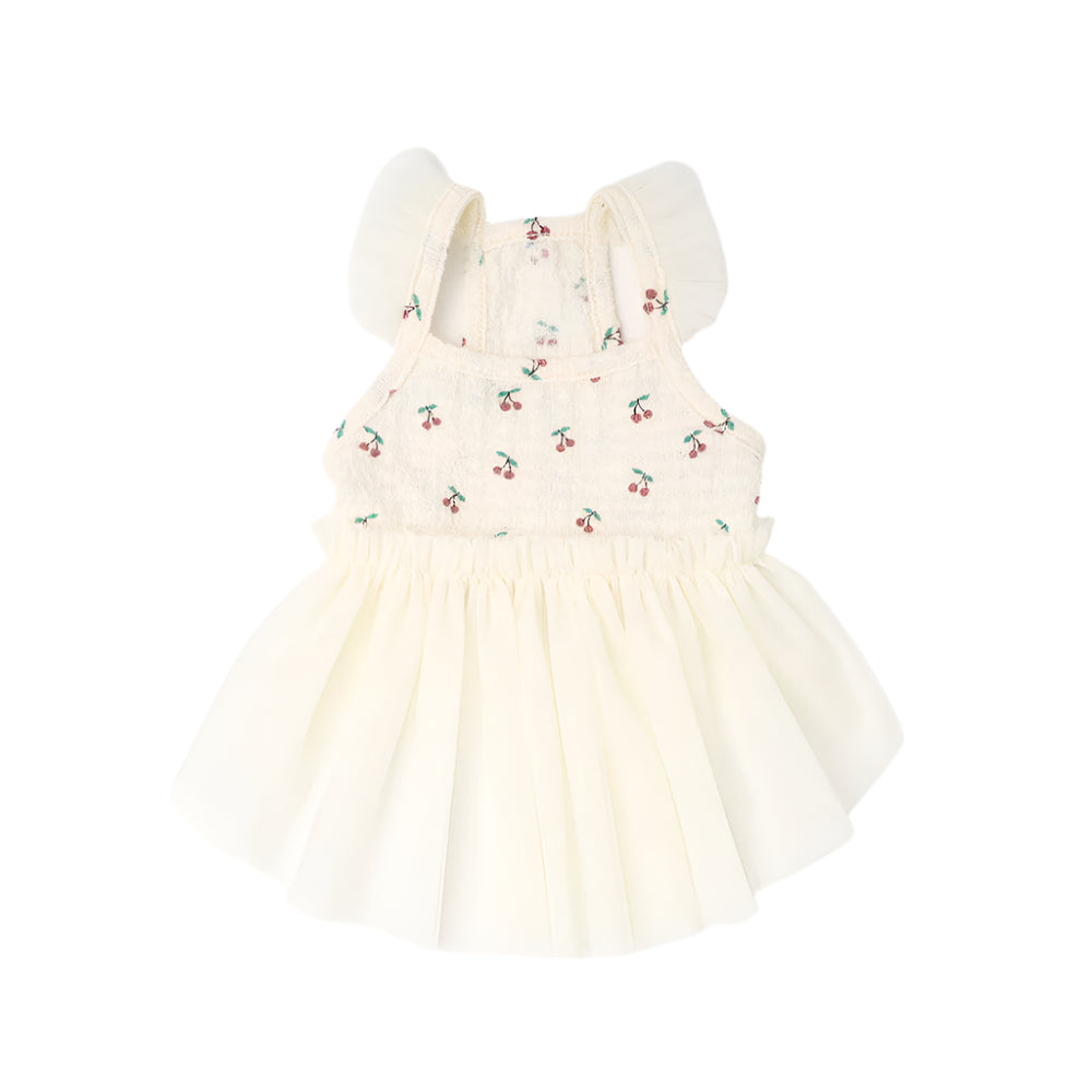 White dress with cherry pattern on a white background