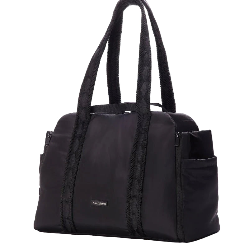 Black dog carrier with multiple pockets on a white background