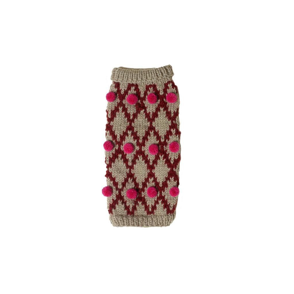 Knitted sweater with geometric pattern and pink pom-poms on a white background