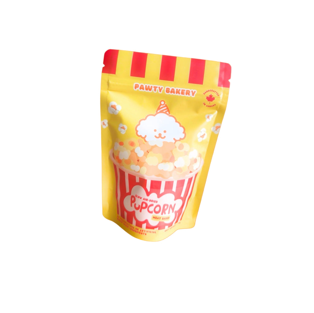 Packaged popcorn with 'Pawty Bakery' branding on an orange background with popcorn graphics.