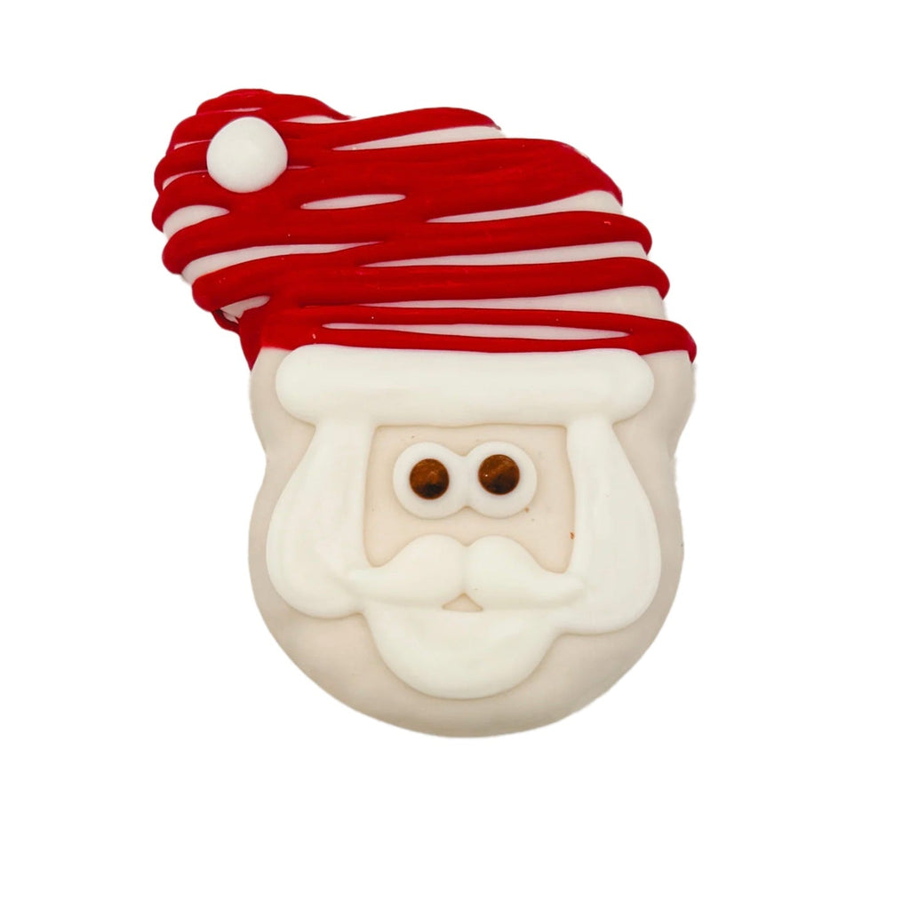 Decorative cookie shaped like a Santa Claus face with a red hat on a white background