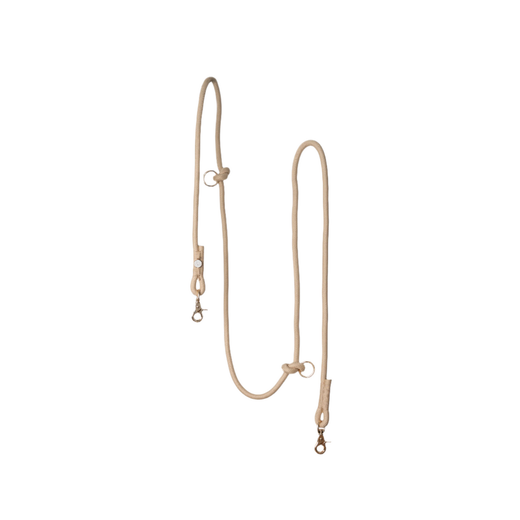 Beige rope dog leash on a white background