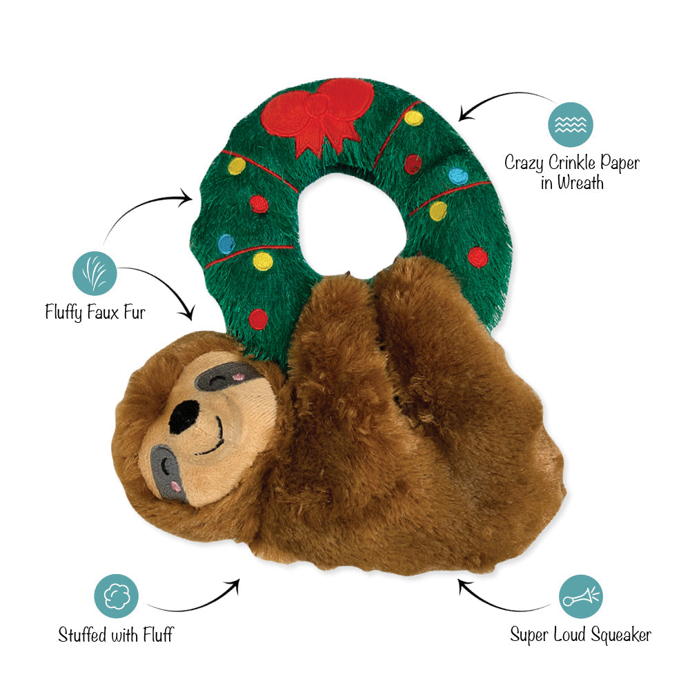sloth hanging from a wreath plush toy