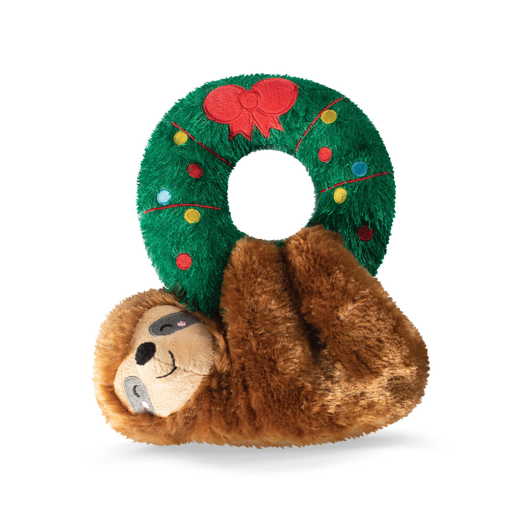 sloth hanging from a wreath plush toy